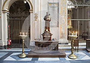 Saint Anthony of Padua with the infant Jesus, offertory in Basilica Saint Maria of Trastevere photo