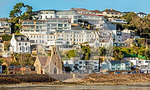 Saint Aubin town seashore view with Sacred heart of Jesus church,, bailiwick of Jersey, Channel Islands