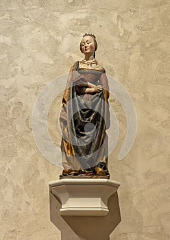 `Saint Barbara`, a limewood with paint statue circa 1490, on display in the Cloisters in New York City.