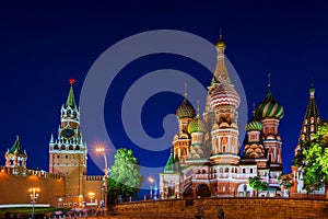 Saint Basil Cathedral on Red Square at night with Kremlin wall and Tower i Moscow, Russia