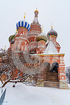 Saint Basil`s Cathedral on Red Square in snowfall. Moscow. Russia