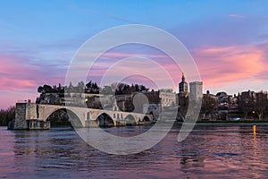 Saint-Beneze Bridge and Notre Dame des Dones and sunset sky in Avignon, France photo