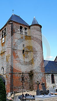 Saint Corneille et Saint Cyprien fortified catholic church with defense tower in the village of Hary in the Aisne