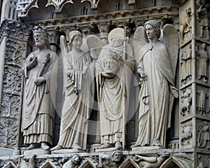 Saint Denis Statue Holding His Head at Notre Dame Cathedral