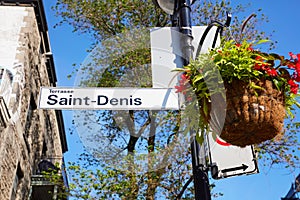 Saint Denis street sign attached to lamp post in Montreal Quebec