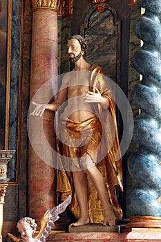 Saint Dismas, statue on the main altar of the church of Holy Trinity in Klenovnik, Croatia photo