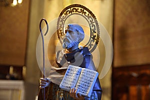 Saint figure with the bible in an catholic church.