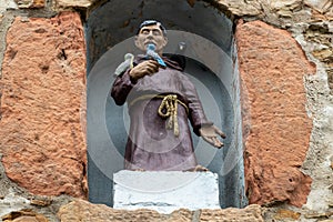 Saint Francis statue in the city gate Werther Tor in Bad Muenstereifel