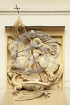 Saint George killing Dragon. Stucco decoration on Art Nouveau bu