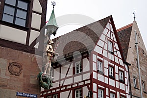 Saint George slaying the dragon, corner figure at the Pilatushaus, Nuremberg, Germany