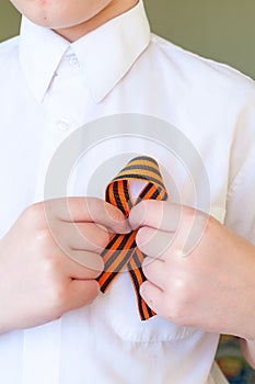 saint george striped ribbon on man clothes. 9 may victory day in russia. Victory Day