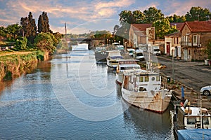 Saint-Gilles, Gard, Occitanie, France: waterway with boats in the town at the edge of the Camargue photo