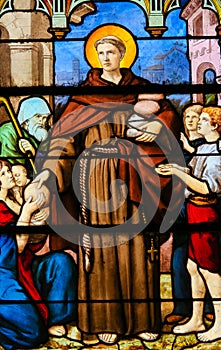 Saint handing out food to the poor - Stained Glass
