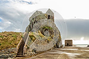 Saint Helier hermitage site with medieval chapel on top with german ww2 bunker in the background, bailiwick of Jersey, Channel photo