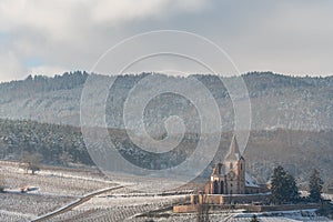 Saint-Jacques-le-Majeur mixed church under the snow near the wine route