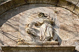 Saint James baptizing Lupa Queen scene stone bas-relief photo