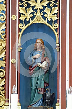 Saint John the Evangelist, statue on the main altar in the church of Our Lady of Miracles in Ostarije, Croatia