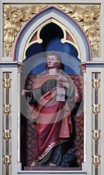 St. John the Evangelist statue on the pulpit in the church of St Matthew in Stitar, Croatia photo