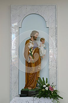 Saint Joseph holding baby Jesus