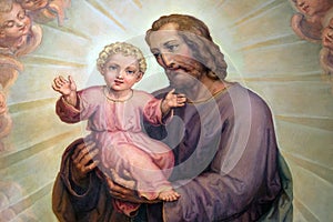 Saint Joseph holding baby Jesus, altarpiece in the Basilica of the Sacred Heart of Jesus in Zagreb photo