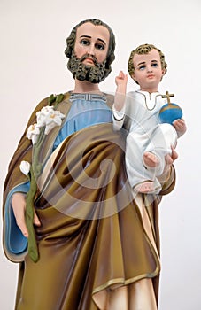 Saint Joseph holding baby Jesus photo