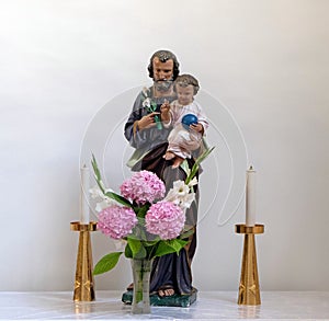 Saint Joseph holding child Jesus