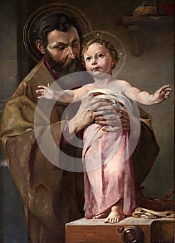 Saint Joseph holding child Jesus