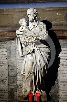 Saint Joseph holding child Jesus