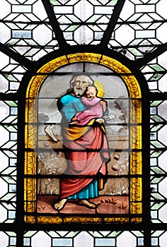 Saint Joseph holding child Jesus