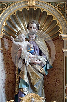 Saint Joseph holding child Jesus