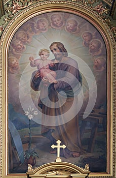 Saint Joseph holding child Jesus