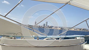 Saint Julians cityscape view from the yacht. Malta lucury vacation. Yachting, ship ownership early retirement concept