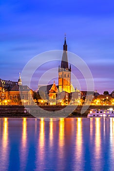 Saint Lambertus Catholic Church; night view of Dusseldorf by the Rhine, Germany