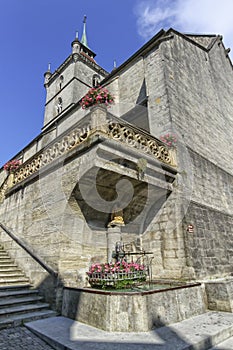 Saint-Laurent collegiate church and fountain in Estavayer-le-lac, Fribourg, Switzerland