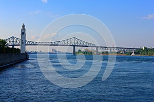 Montreal, Quebec, Clock Tower and Jacques Cartier Bridge over the Saint Lawrence River, Canada