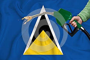 SAINT LUCIA flag Close-up shot on waving background texture with Fuel pump nozzle in hand. The concept of design solutions. 3d