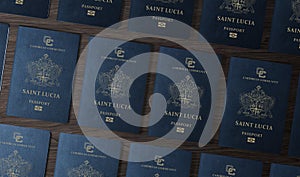 Saint Lucia passports on a wooden table , top view photo