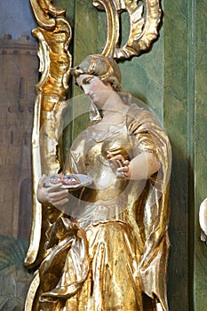 Saint Lucia, statue on the altar of St. Barbara at St. Peter`s Church in Sveti Petar Mreznicki, Croatia