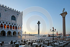 Saint Mark square with empty sidewalk tables, nobody in Venice