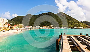 Saint Martin Sint Maarten, St Martin, Island in the Caribbean Sea and the sandy beach seen from the dock of the port of