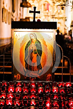 Saint Mary with Rows of Red Candles