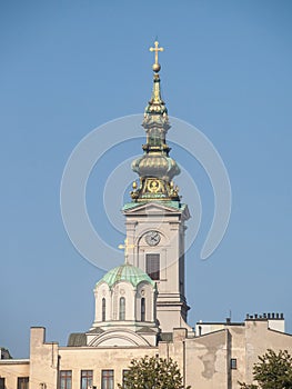 Saint Michael Cathedral, also known as Saborna Crkva, with its iconic clocktower seen from a street of Stari Grad district.