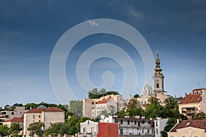 Saint Michael Cathedral, also known as Saborna Crkva, with its iconic clocktower seen from a street of Stari Grad district. It is