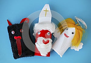 Saint Nicholas, Angel and Devil made by a child from toilet paper roll tubes