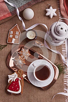 Saint Nicholas Christmas bitten gingerbread cookies and cocoa. Aesthetic seasonal Christmas decorations with hot drink