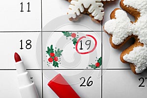 Saint Nicholas Day. Calendar with marked date December 19, marker and snowflake shape gingerbread cookies, top view