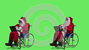 Saint nick with disability using laptop