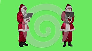 Saint nick waving at videocall on pc