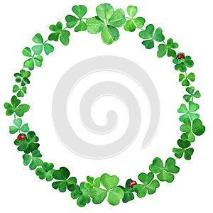 Saint Patrick day background. Watercolor wreath with four leaves clover & blooms. Decorative frame