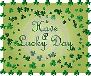 Saint Patrick's Day greeting card with sparkled green clover leaves and text. Inscription - Have A Lucky Day